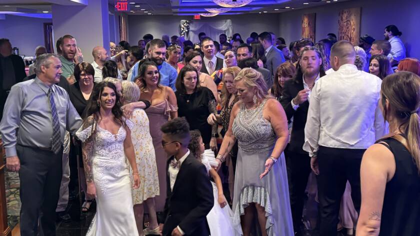 wedding guests mingling on dance floor