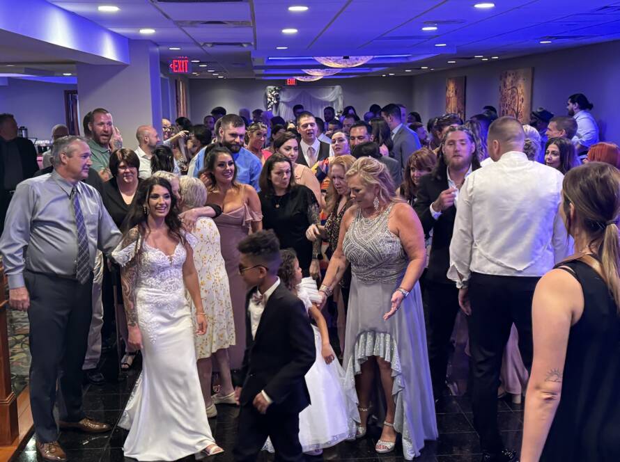 wedding guests mingling on dance floor