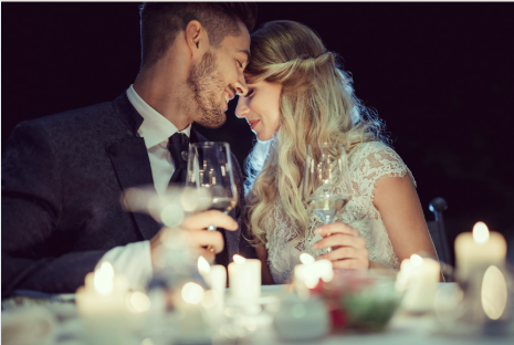 newly engaged couple celebrating with a champagne toast